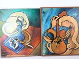 des tableaux représentant une femme jouant de la guitare et un homme lisant un livre
