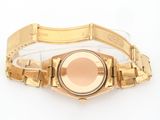 a close up of a gold wrist watch on a white surface