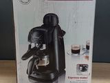 the box of the coffee maker is sitting on the table