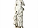 a statue of a woman standing on a pedestal
