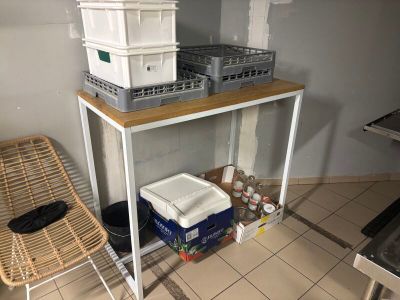 a table with baskets on top of it in a kitchen
