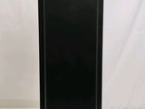 an image of a black speaker stands on a white surface