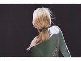 painting of a woman with a ponytail in a green top