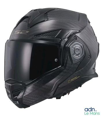 Le casque est en fibre de carbone et est équipé d'une large vis de serrage.