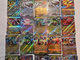 a pile of pokemon cards sitting on top of a table