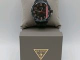 a watch sitting on top of a box with a pillow