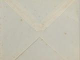 an old envelope with a piece of paper sticking out of it