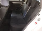 the back seat of a car with a seat belt in it