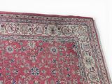 an image of a red rug with a floral design on it