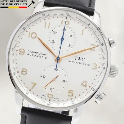 a close up of a wrist watch with a white dial