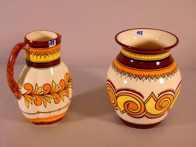two vases sitting next to each other on a table