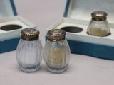 two salt and pepper shakers sitting in a box