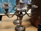 a silver candelier on a table in a store