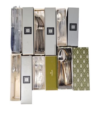 a lot of silverware in a box on the table
