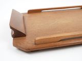 a wooden tray with a wooden handle on it