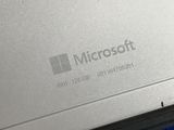 a close up of a laptop with a microsoft logo on it