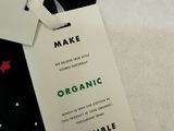 a tie with a tag on it that says organic