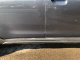 a close up of a car door with a sticker on it