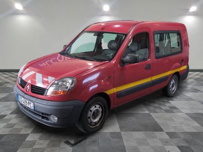a red van that is parked on a checkered floor