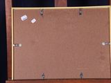 a picture of a piece of art on a easel