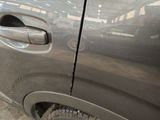 a close up of a car door handle with a sticker on it