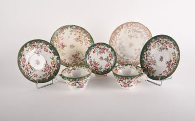 an image of a group of plates and bowls on a white surface