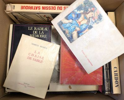 many books in a box that are sitting on top of each other