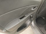a car door open with the driver ' s seat down
