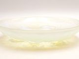 a glass bowl that is sitting on a table
