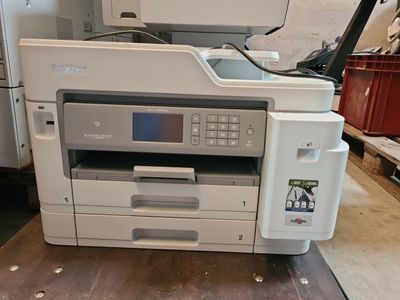 a printer sitting on top of a table in a room