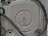 an image of a dishwasher with a hose attached to it