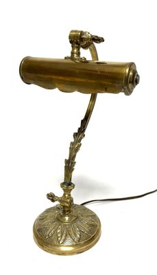 an image of a brass desk lamp with a bird on it