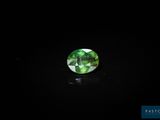 a green tourmaline gems on a black background