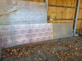 a large sheet of plastic sitting on the ground in front of a building