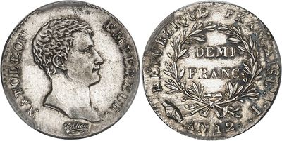 a silver coin with an image of a woman on it
