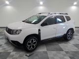 the white dacia is parked on a checkered tile floor