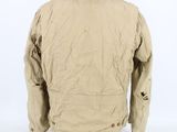 the back view of a tan jacket on a mannequin head