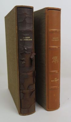 two books that are sitting side by side on a table