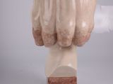 sculpture of a woman ' s head on a marble base