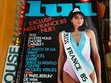 magazines in a box with a woman in a swimsuit on top of it