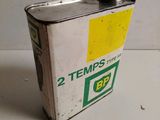 a metal flask with a yellow and green label on it
