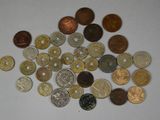 a pile of coins on a table with a white background