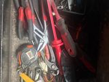a box full of tools that are sitting on the floor