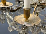 a close up of a chandelier with a candle