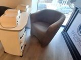 two chairs and a table in a small room