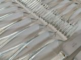 a lot of silverware on a table with a knife and fork
