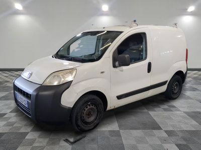 a picture of a white van parked on a checkered floor