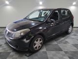 a picture of a small black car parked on a checkered floor