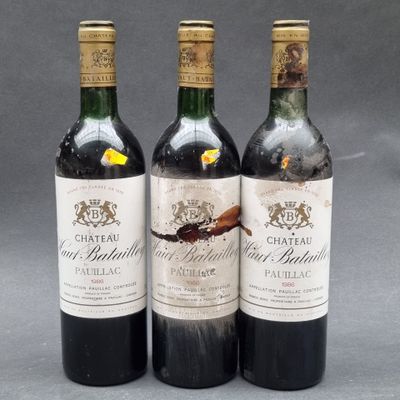 three bottles of wine sitting on top of a table next to each other