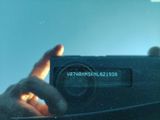 a person taking a picture of themselves in a car mirror